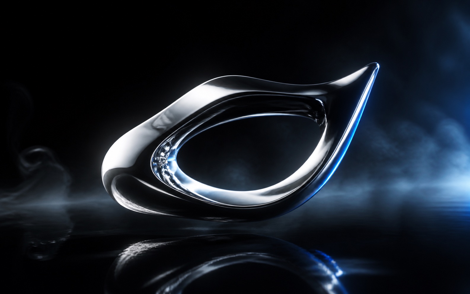 A polished chrome object floating over black glass